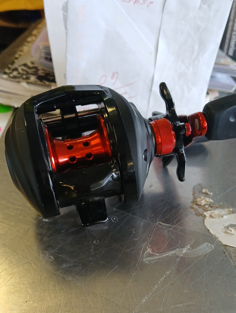 Black and Red Baitcasting Fishing Reel - Left-Hand Crank